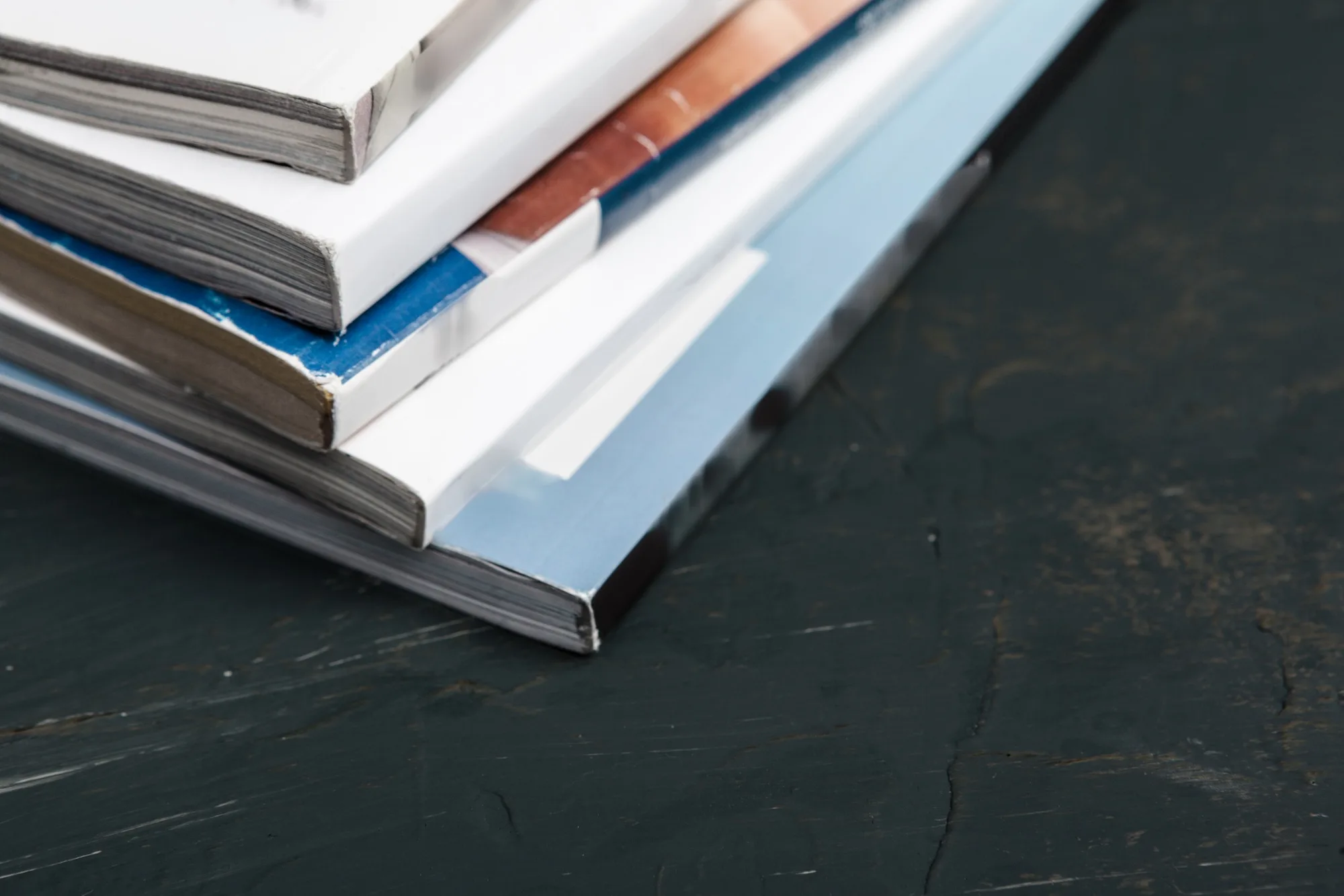 Close up stacking magazine place on table background